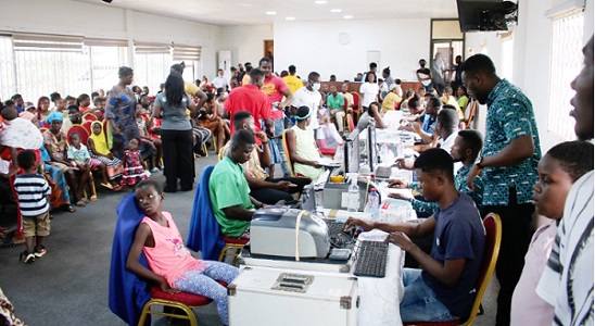 Officials registering some beneficiaries onto the National Health Insurance Scheme. Picture: DELLA RUSSEL OCLOO